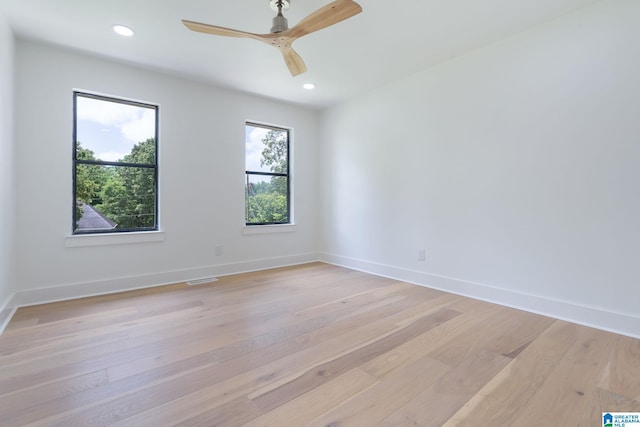 unfurnished room with light hardwood / wood-style floors and ceiling fan