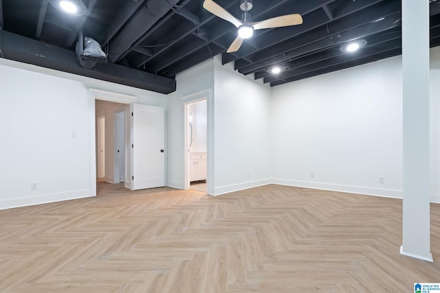 basement with light parquet flooring and ceiling fan