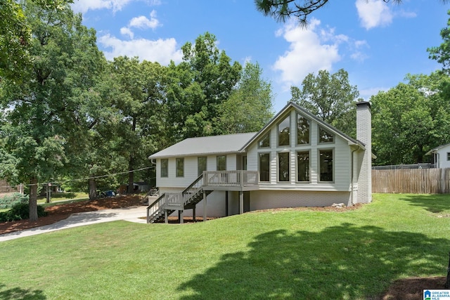 back of house featuring a lawn