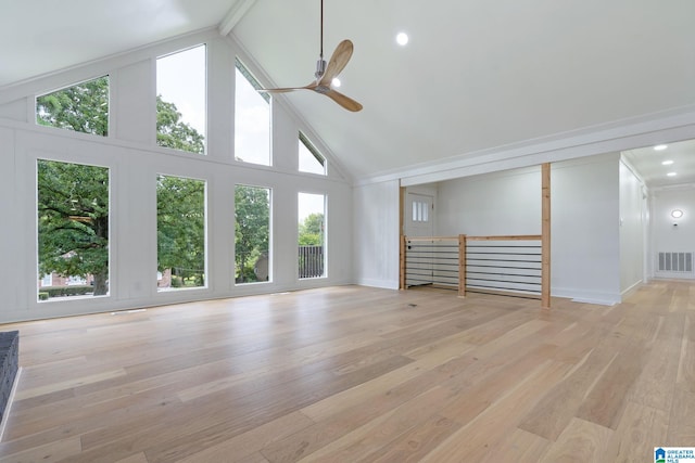 unfurnished living room featuring light hardwood / wood-style floors and high vaulted ceiling