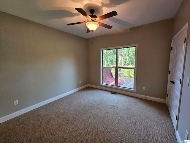 unfurnished bedroom featuring ceiling fan and carpet floors