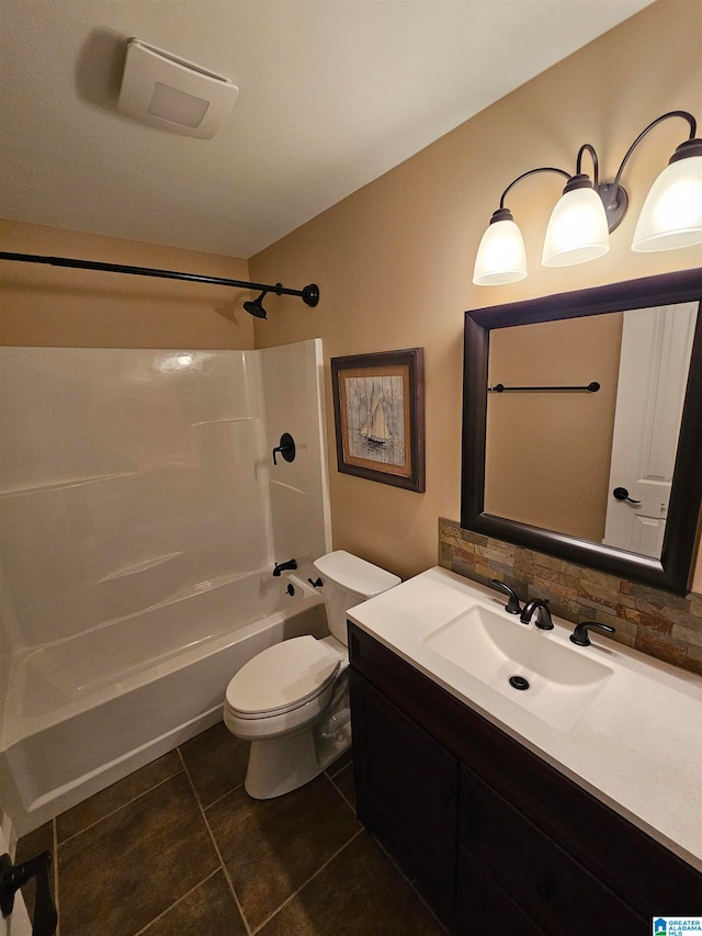 full bathroom with tile patterned floors, toilet, bathing tub / shower combination, tasteful backsplash, and vanity