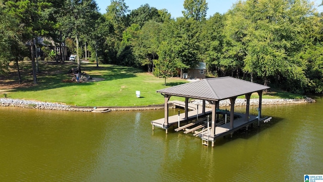 dock area featuring a water view and a yard