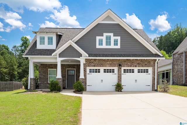 craftsman-style home with a garage and a front yard