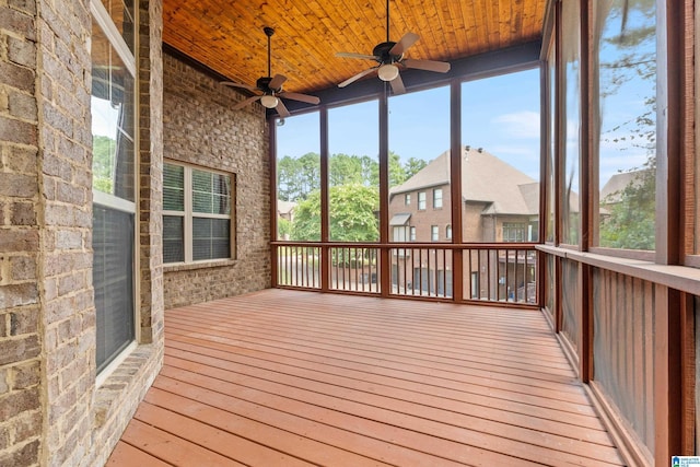 unfurnished sunroom with wood ceiling