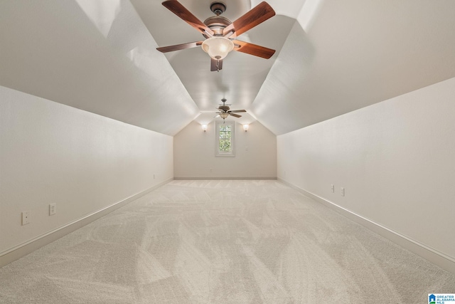 bonus room featuring lofted ceiling and light carpet