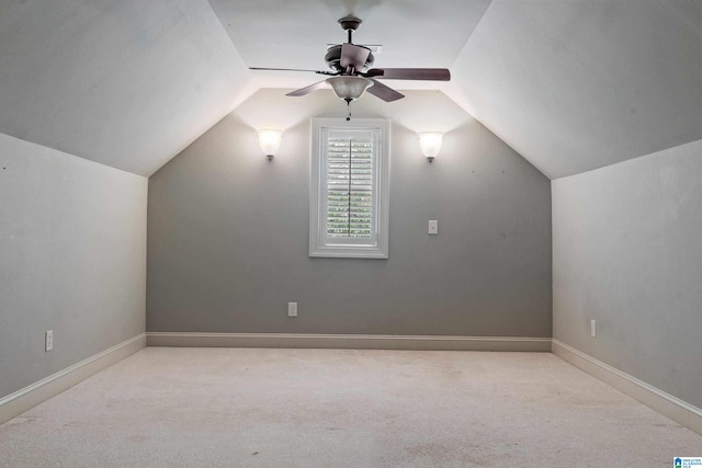 bonus room with lofted ceiling, light colored carpet, and ceiling fan