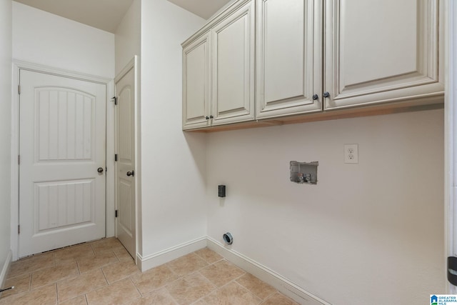 laundry area with cabinets, light tile patterned flooring, hookup for an electric dryer, and washer hookup