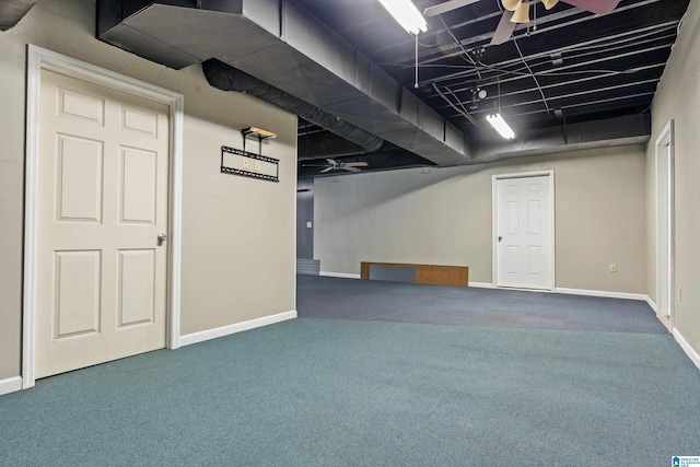 basement featuring ceiling fan and carpet floors