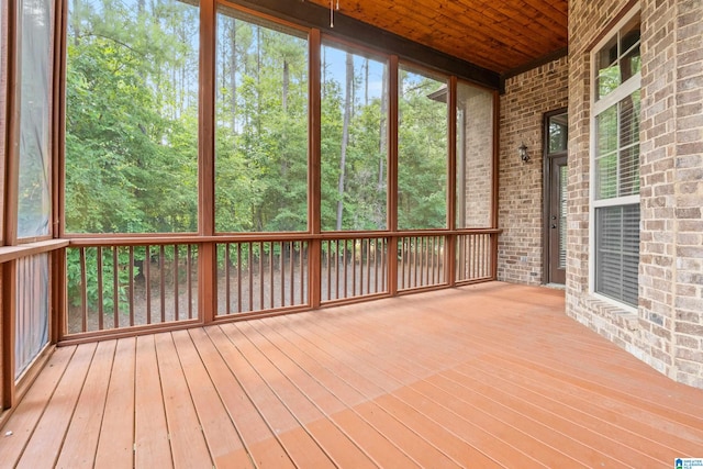 unfurnished sunroom featuring wood ceiling