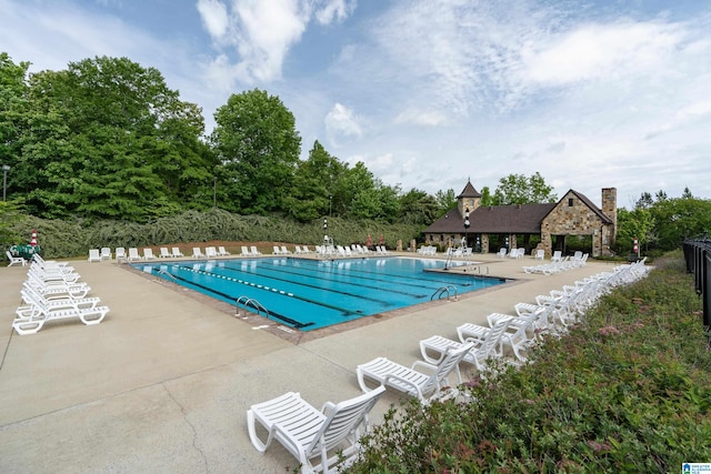 view of swimming pool with a patio