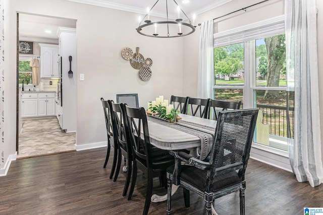 dining space featuring dark hardwood / wood-style floors, a notable chandelier, and plenty of natural light