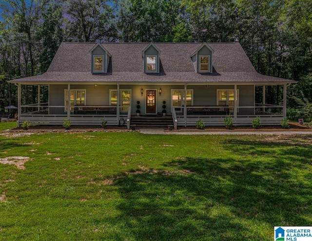 farmhouse inspired home with a porch and a front lawn