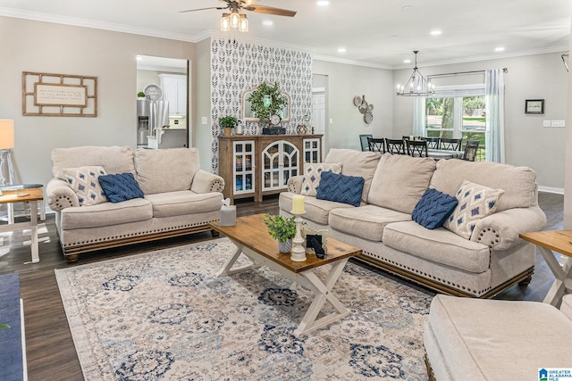 living area with recessed lighting, baseboards, dark wood finished floors, crown molding, and ceiling fan with notable chandelier