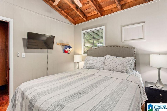 bedroom featuring wooden ceiling, vaulted ceiling, and wood finished floors