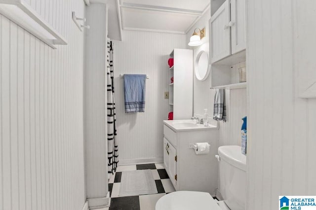 bathroom featuring curtained shower, vanity, toilet, and tile patterned floors