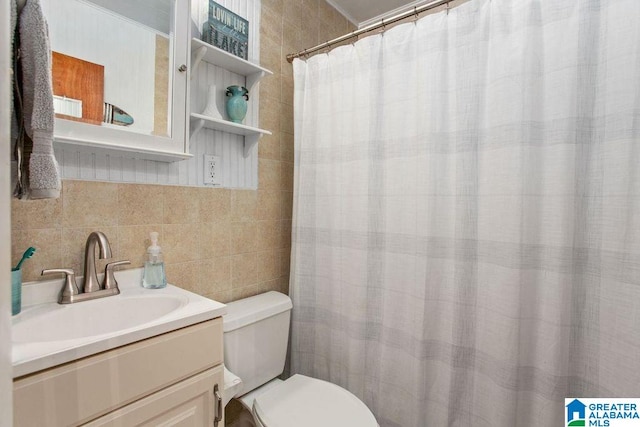 full bath with toilet, a shower with curtain, tile walls, and vanity