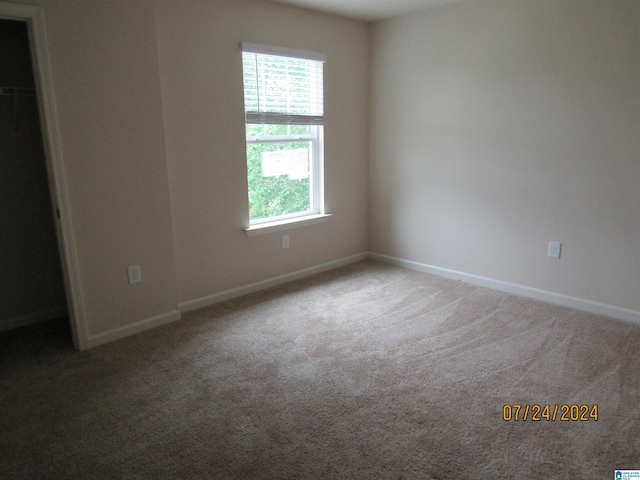 unfurnished bedroom featuring baseboards and carpet floors