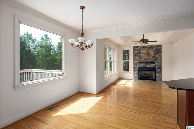 unfurnished living room with plenty of natural light, a fireplace, and light wood-type flooring