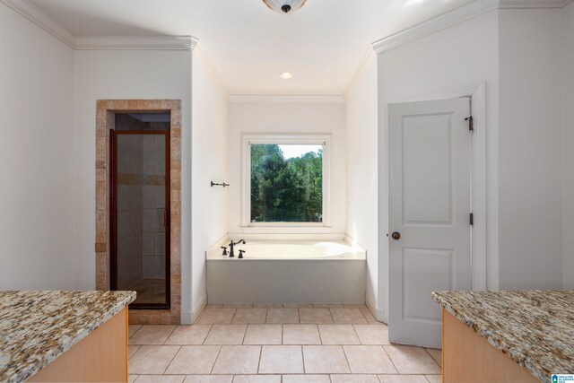 bathroom with vanity, tile patterned floors, and a bathing tub