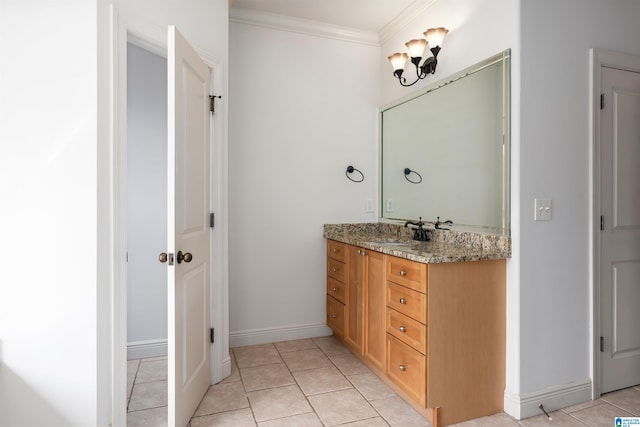 bathroom with tile patterned flooring, crown molding, and vanity