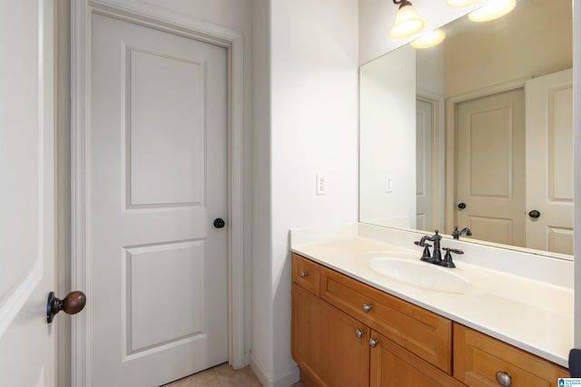 bathroom featuring tile patterned flooring and vanity