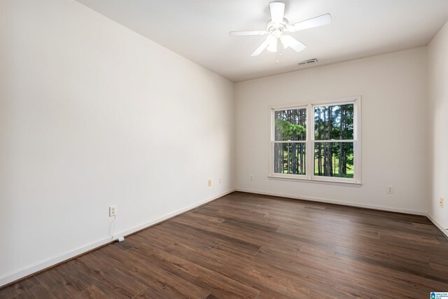 unfurnished room featuring dark hardwood / wood-style flooring and ceiling fan