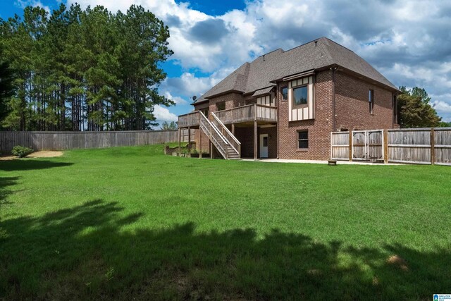 view of yard with a wooden deck