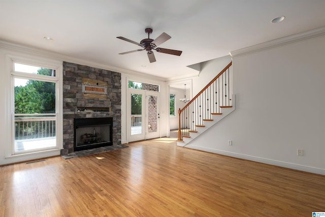 unfurnished living room featuring a healthy amount of sunlight, light hardwood / wood-style flooring, and ceiling fan