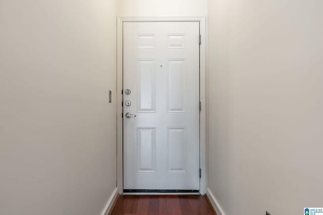 doorway featuring dark hardwood / wood-style floors