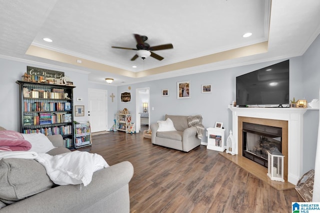 25 County Road 942, Clanton, AL 35045 - living room with a ceiling fan, a tray ceiling, ornamental molding, and wood finished floors