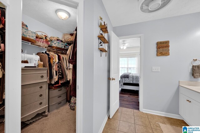 walk in closet featuring light tile patterned floors