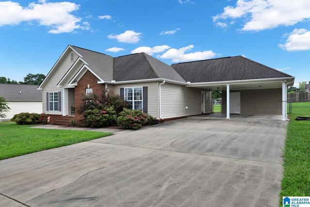 view of front facade featuring a front lawn and a carport