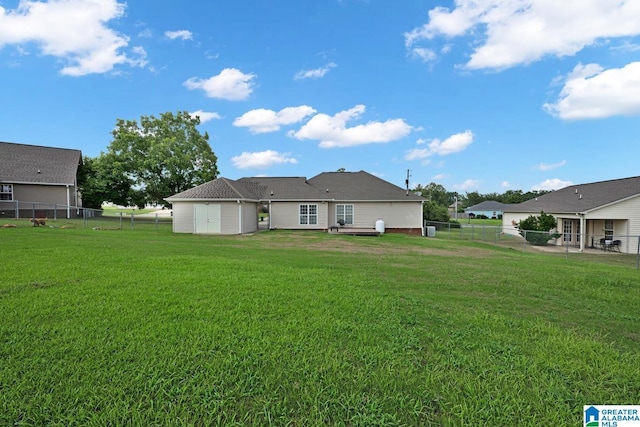 25 County Road 942, Clanton, AL 35045 - back of property with a yard and a fenced backyard