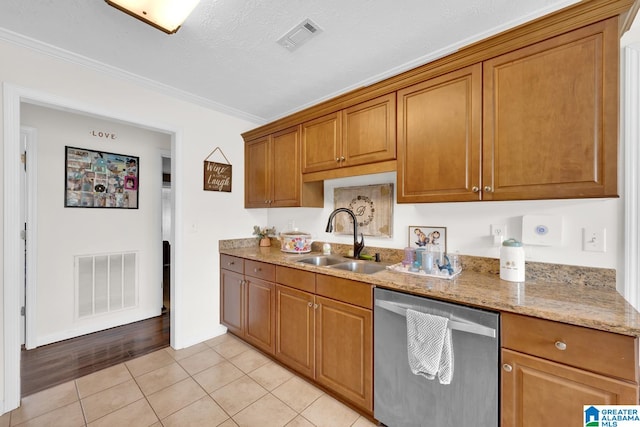 kitchen featuring crown molding, dishwasher, light stone countertops, light wood-type flooring, and sink