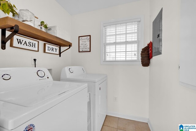 washroom featuring light tile patterned floors, electric panel, and washer and dryer