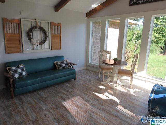 living room featuring vaulted ceiling with beams and hardwood / wood-style floors