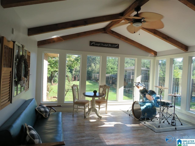 sunroom / solarium featuring vaulted ceiling with beams and ceiling fan