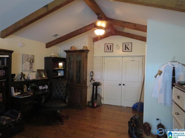 office area with hardwood / wood-style flooring, vaulted ceiling with beams, and ceiling fan