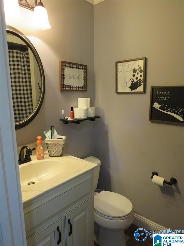 bathroom with vanity and toilet