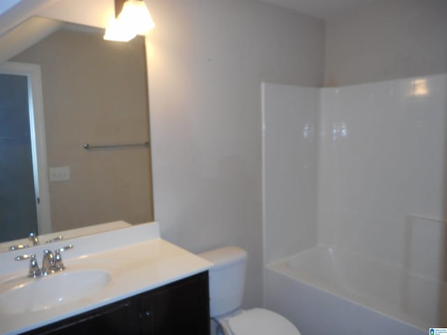 full bathroom featuring shower / tub combination, vanity, and toilet