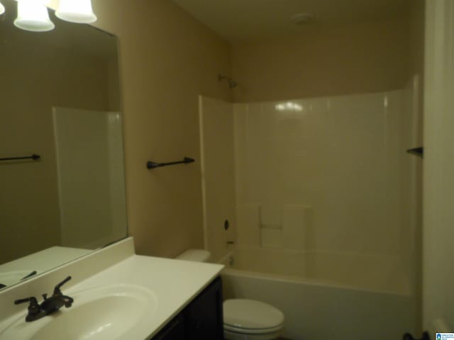 full bathroom with shower / bathtub combination, toilet, and vanity