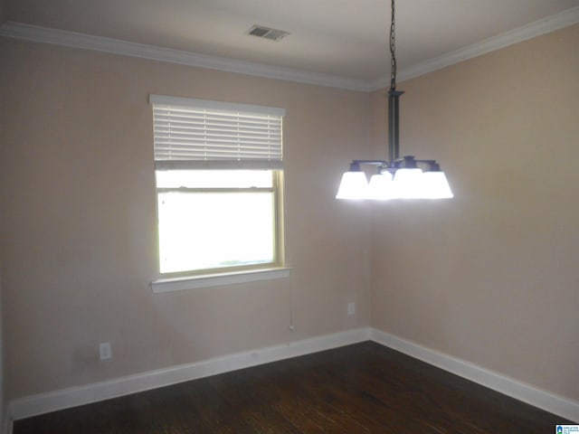 interior space with an inviting chandelier, crown molding, and dark hardwood / wood-style floors