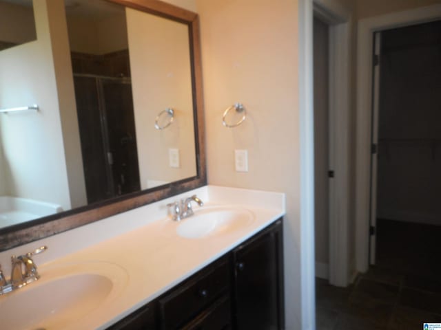 bathroom featuring tile patterned flooring and dual vanity