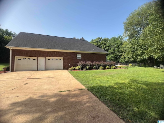 view of front of home with a garage and a front yard