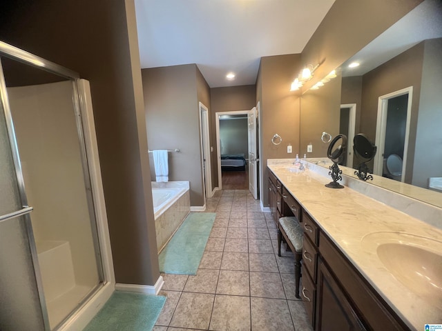 bathroom with shower with separate bathtub, tile patterned flooring, and double vanity