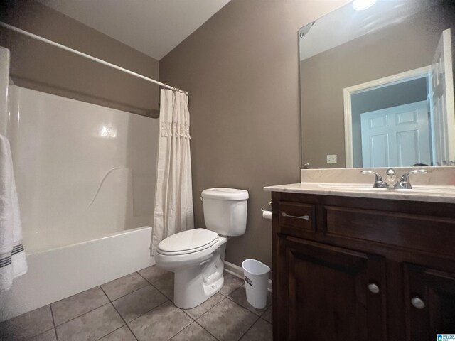 full bathroom with tile patterned floors, vanity, toilet, and shower / bath combination with curtain