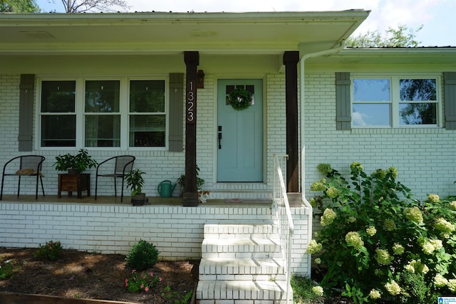 property entrance with covered porch