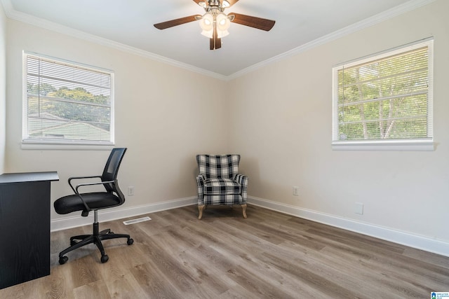 office featuring hardwood / wood-style flooring, crown molding, and ceiling fan