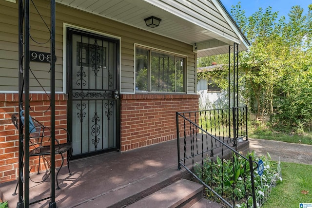 doorway to property featuring covered porch